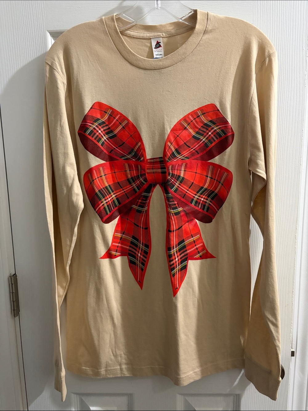 Beige Long-Sleeve Top with Red Plaid Bow Graphic